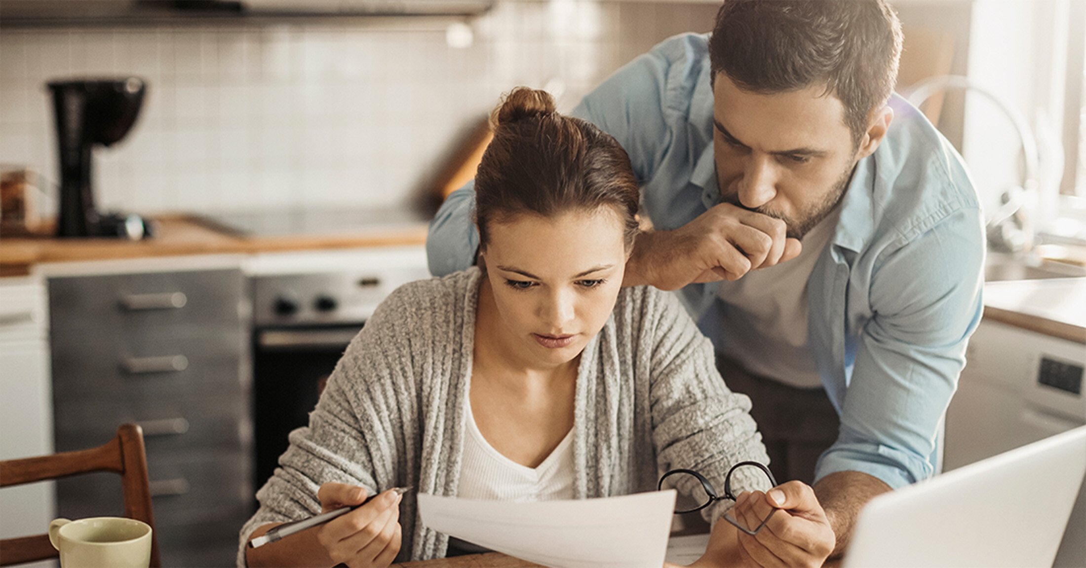 A young couple going over their bills.